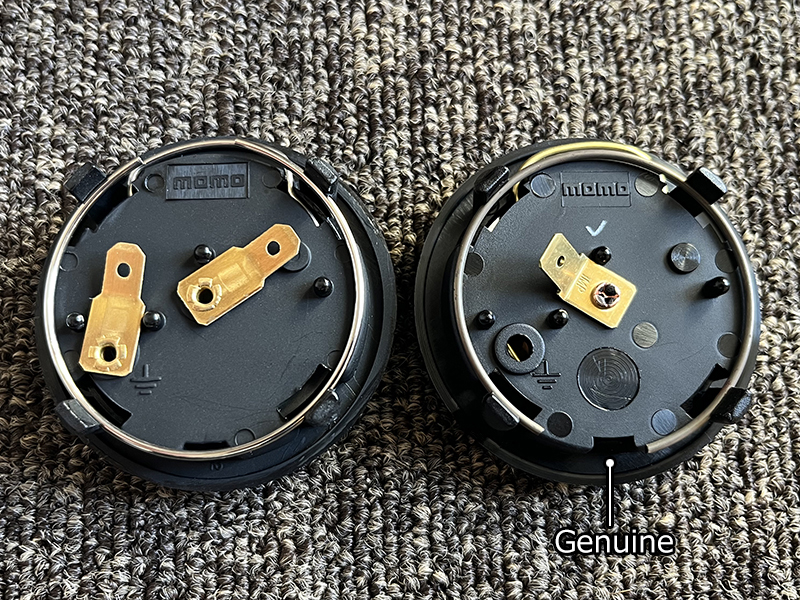 Comparison of genuine NSX 02R horn button and fake one (back side)